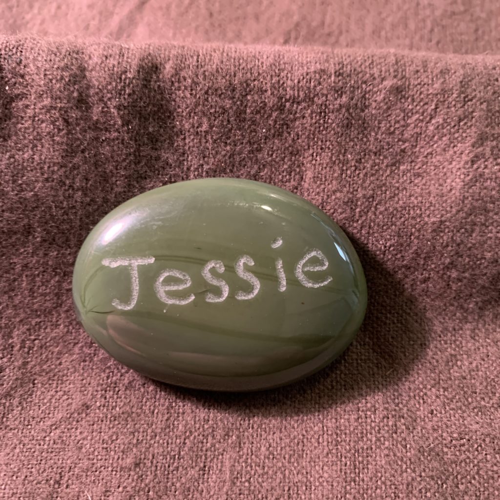 Green MyRockAndI worry stone with Jessie name engraved on it
